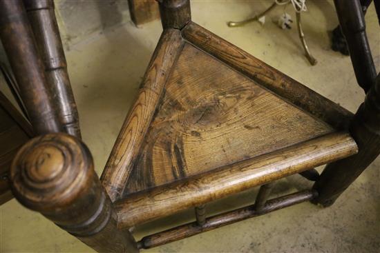 A 19th century turners chair, with triangular seat and ball-turned spars to back